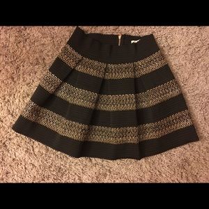 Black skater skirt with gold accents